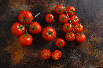 Fototapeta na wymiar Fresh cherry tomatoes on a metal rustic old background space for text.