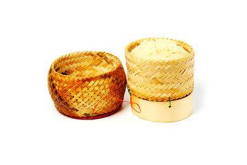 Woven bamboo rice box for sticky rice on white background. Streamed sticky rice in traditional Thai wicker basket.