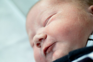 Beautiful sleeping baby boy just one day old
