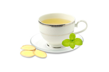Hot Ginger tea in white cup with green mint leaves