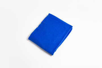 Blue folded towel isolated on white background. Bath towel.High-resolution photo.Top view.