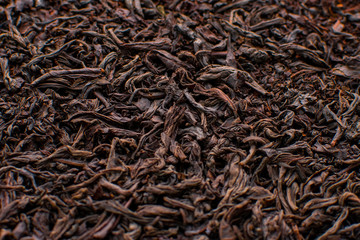 Black tea loose dried tea leaves, marco. Close-up tea leaves.