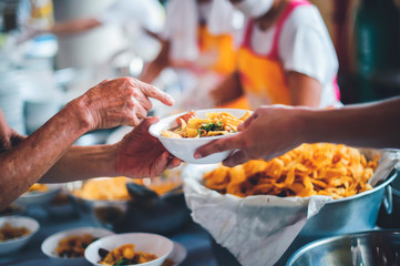 Feeding to the poor to hands of a beggar : concept of feeding food for beggar