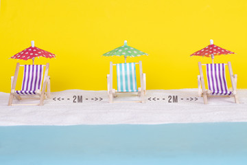 COVID 19 protection on beach vacation. Separation, social distancing at summer holidays. Beach...