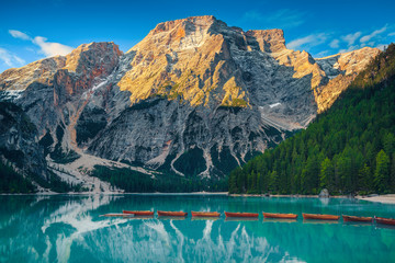 Touristic leisure wooden boats on the alpine lake, Dolomites, Italy