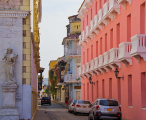 Walking the narrow and colorful streets with historic old buildings with wooden balconies and urban...