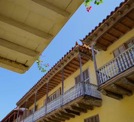 Walking the narrow and colorful streets with historic old buildings with wooden balconies and urban...