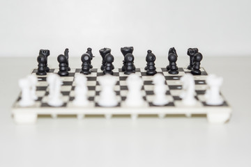 Chess board with figures on isolate white background.
