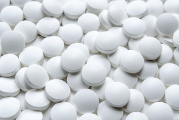 White pills close up background