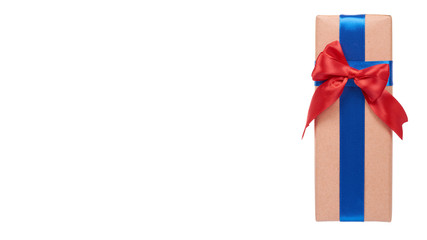 Gift box wrapped with brown paper. Isolated.