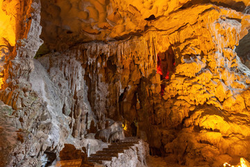 Stalactite and stalagmite formations in a limestone cave of Halong Bay, Vietnam