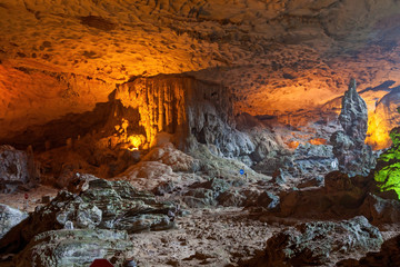 Stalactite and stalagmite formations in a limestone cave of Halong Bay, Vietnam