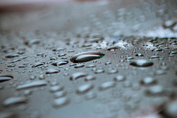 Water droplets rolling on the object