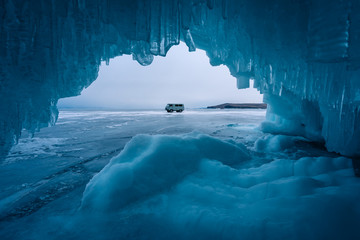 Blue ice cave in Baikal frozen lake in winter season, Siberia, Russia