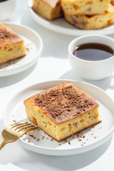 Slice of fruit pie on a white plate.