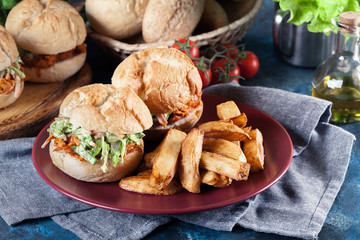 Pulled chicken sandwich with salad and bbq sauce
