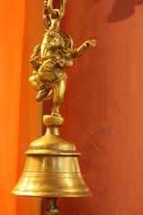 Fototapeta na wymiar Brass bell with Lord Ganesha art .