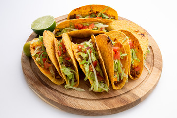 baked oven beef taco with tomato, lemon and lettuce