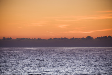 Sunrise or sunset over sea surface