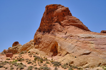 Fototapeta na wymiar Large monoliths and smooth glacial carved rocks mark the Nevada Desert