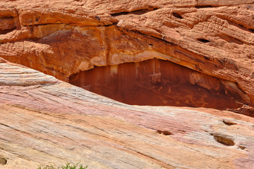 Orange rock faces and pink and white plateaus in the Nevada Desert
