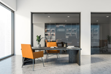 White CEO office interior with orange chairs