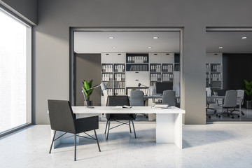 Grey CEO office interior with black chairs