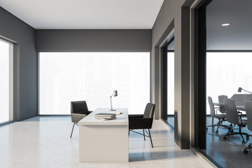 Grey CEO office with black chairs