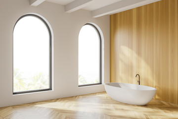 Arched white and wooden bathroom corner with tub