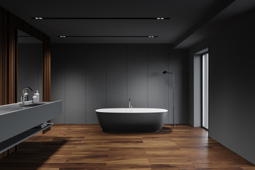 Obraz na płótnie Canvas Grey and wooden bathroom, tub and sink