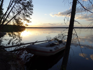 Obraz premium Sunset over taiga lake.