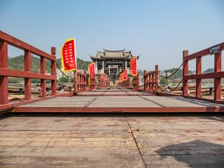 Naklejka premium Chaozhou/China-02 April 2018:Unacquainted people on Guangji Bridge at Chaozhou City China.also known as Xiangzi Bridge,is an ancient bridge that crosses the Han River east of Chaozhou