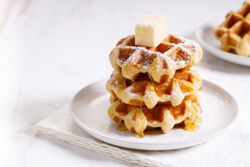 fresh baked waffles in a white plate