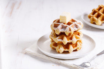 fresh baked waffles in a white plate