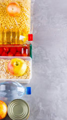 Food donations on gray background. Set of food products. Food supplies. Top view. Copy space