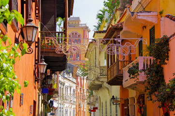 Walking the narrow and colorful streets with historic old buildings with wooden balconies and urban...