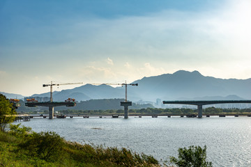 Fototapeta na wymiar under construction arch bridge across Nakdonggang river in Yangho-dong, Gumi-Si, Gyeongsangbuk-do, South Korea