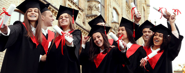 Happy students with diplomas near campus. Banner design