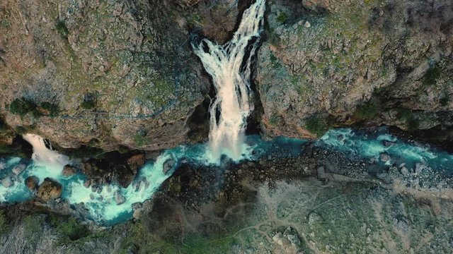AERIAL. Huge forest waterfall and blue river cinematic style video.
