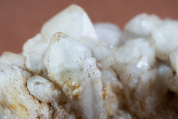 Macro photography of quartz crystals with pyramidal shapes.