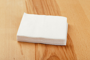white paper napkin with a textured pattern on an old table