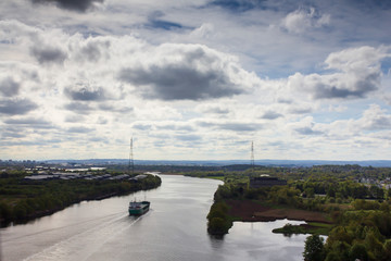 Industrial cargo ship  sailing up the river Clyde on a Spring morning. 