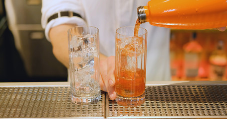 Male Bartender work in the pub