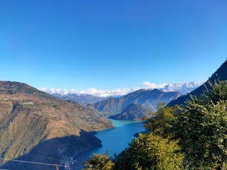 Beautiful lake inthe mountains with blue sky at Chamba, Himachal Pradesh, India. January 2020