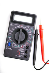 Fototapeta premium Digital multimeter and probes on white background