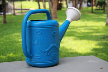 blue watering can
