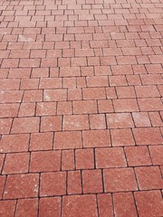 The pavement on the sidewalk is lined