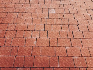 The pavement on the sidewalk is lined