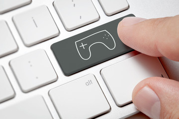 Game Workspace Concept:Macro male hand pressing computer key Joystick illustration.Joystick and keyboard on white background.. © Basak