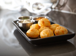 Cheese Bread served in a restaurant. 

Brazilian snack cheese bread - Traditional Brazilian food.